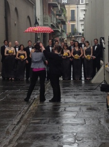 A bridal party posing for pictures adjacent to the cathedral 